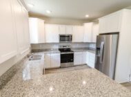 kitchen with white cabinets