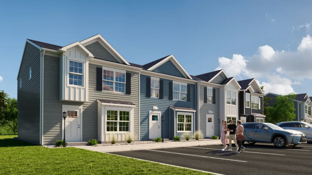 Row of modern townhomes with parking and people walking in front
